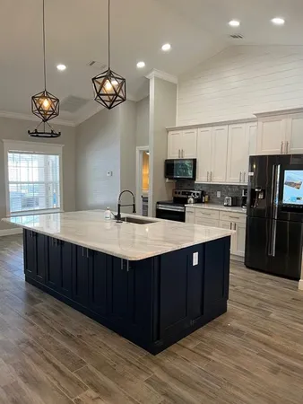 a bathroom with a shower and a sink