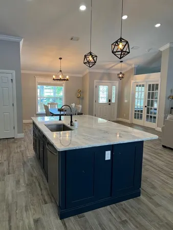 a bathroom with double vanity and a mirror