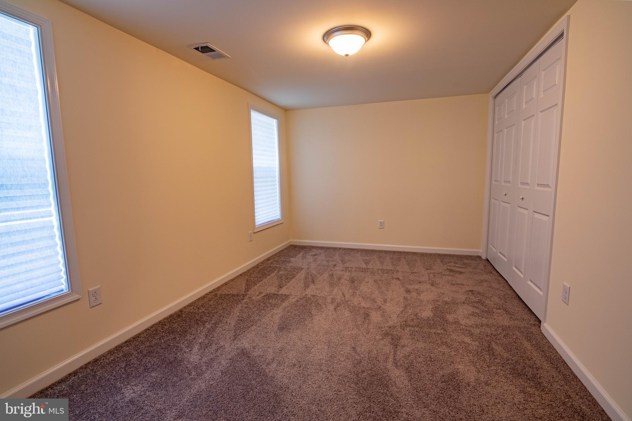 1221 Ball Road Port Republic, MD 20676 - Photo 23 of 72 an empty room with a empty space and windows