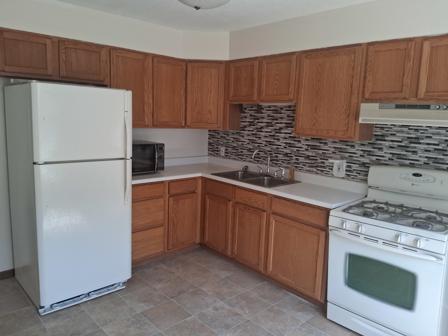 601 Catlin Street Ottawa, IL 61350 - Photo 16 of 29 a kitchen with a sink stove and refrigerator
