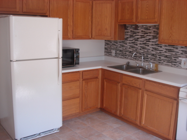 601 Catlin Street Ottawa, IL 61350 - Photo 17 of 29 a white refrigerator freezer sitting in a kitchen