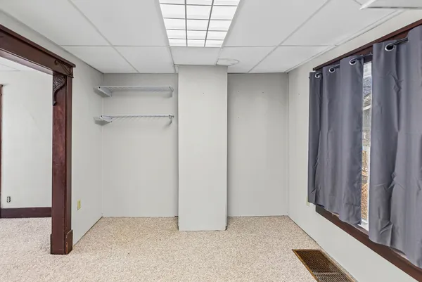 a view of empty room with a glass door