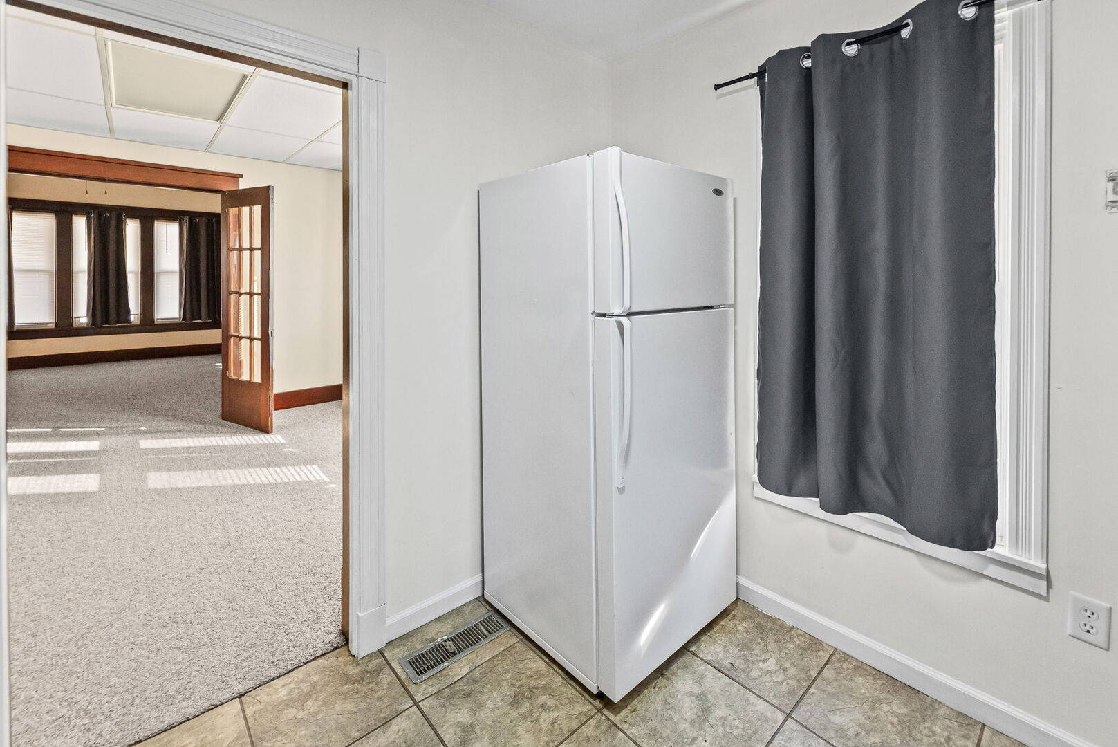 527 East 4th Street Centralia, IL 62801 - Photo 21 of 39 a view of a refrigerator in kitchen and furniture