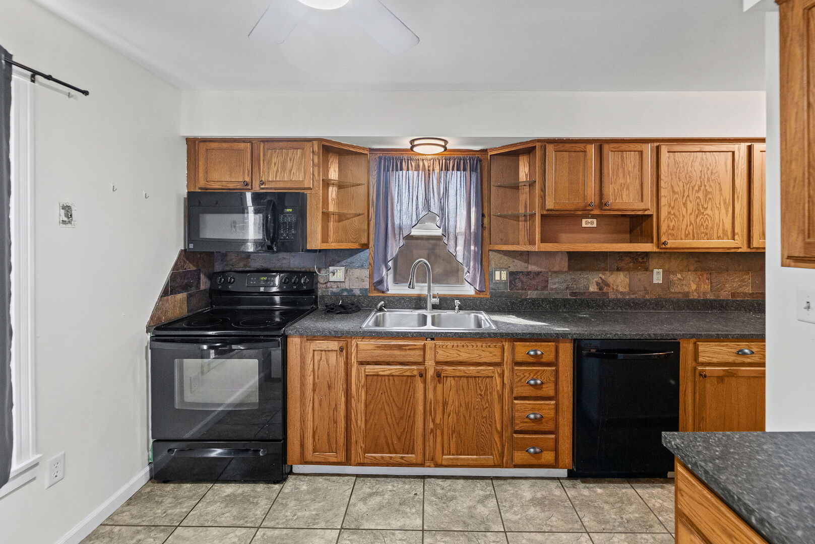 527 East 4th Street Centralia, IL 62801 - Photo 23 of 39 a kitchen with a sink stove and cabinets