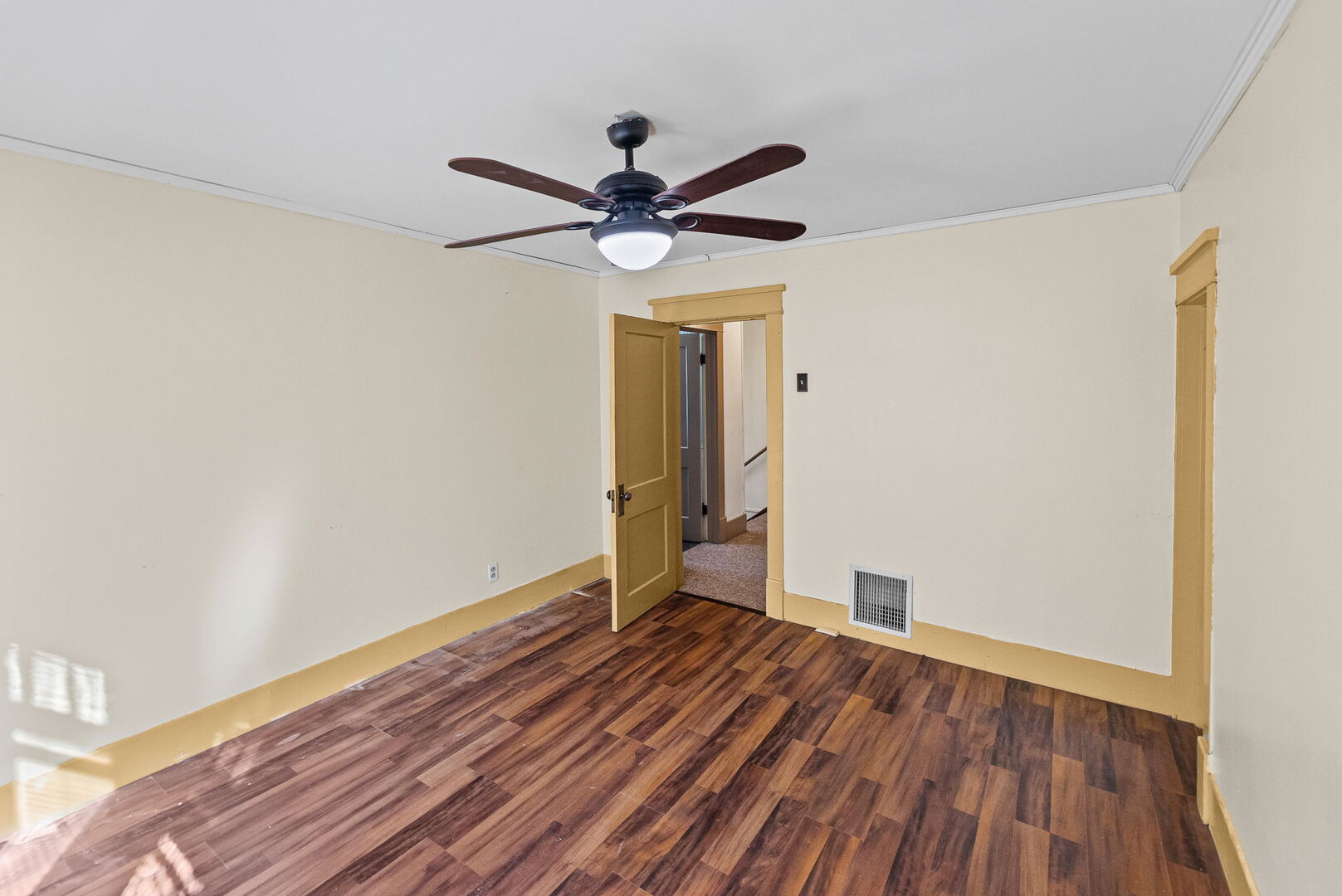 527 East 4th Street Centralia, IL 62801 - Photo 35 of 39 a view of room with hardwood floor and a ceiling fan
