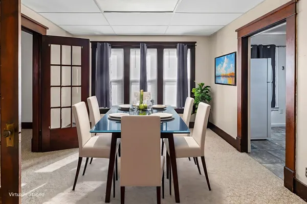 a view of a dining room with furniture window and outside view