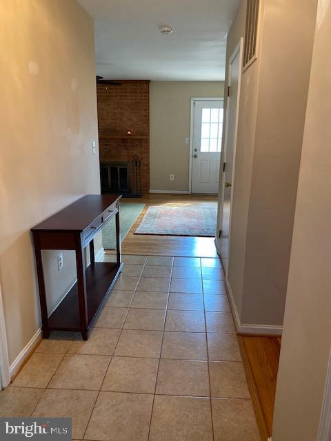 8777 Hunt Trail Warrenton, VA 20187 - Photo 3 of 13 Tile flooring flows into SOLID Hardwood flooring