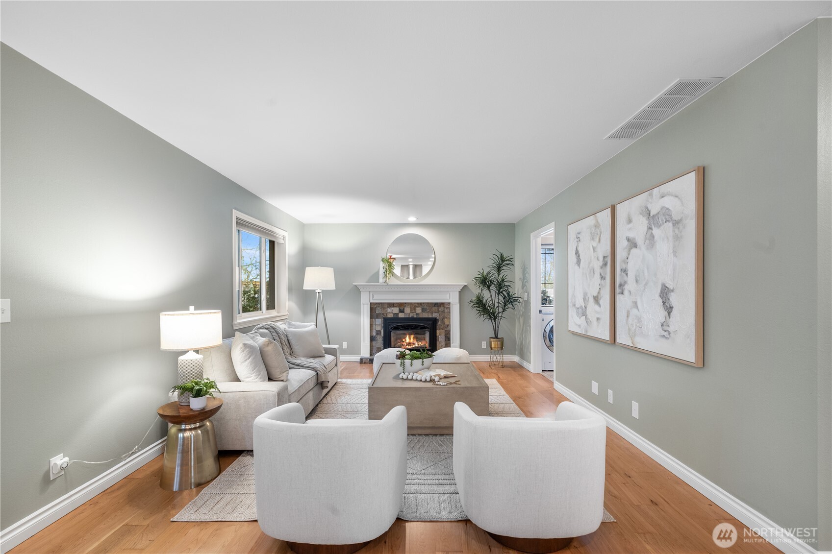 12103 Northeast 168th Place Bothell, WA 98011 - Photo 13 of 36 a living room with furniture a fireplace and a large window