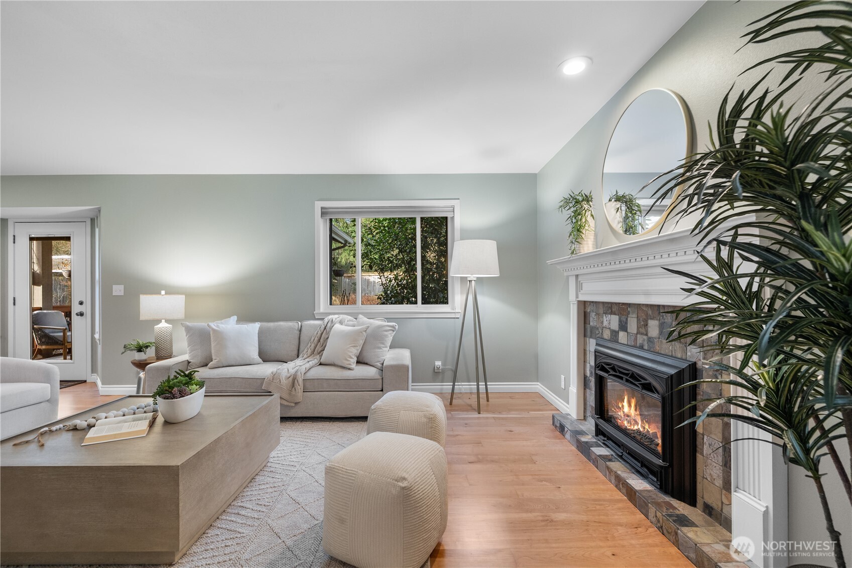 12103 Northeast 168th Place Bothell, WA 98011 - Photo 14 of 36 a living room with furniture fireplace and window