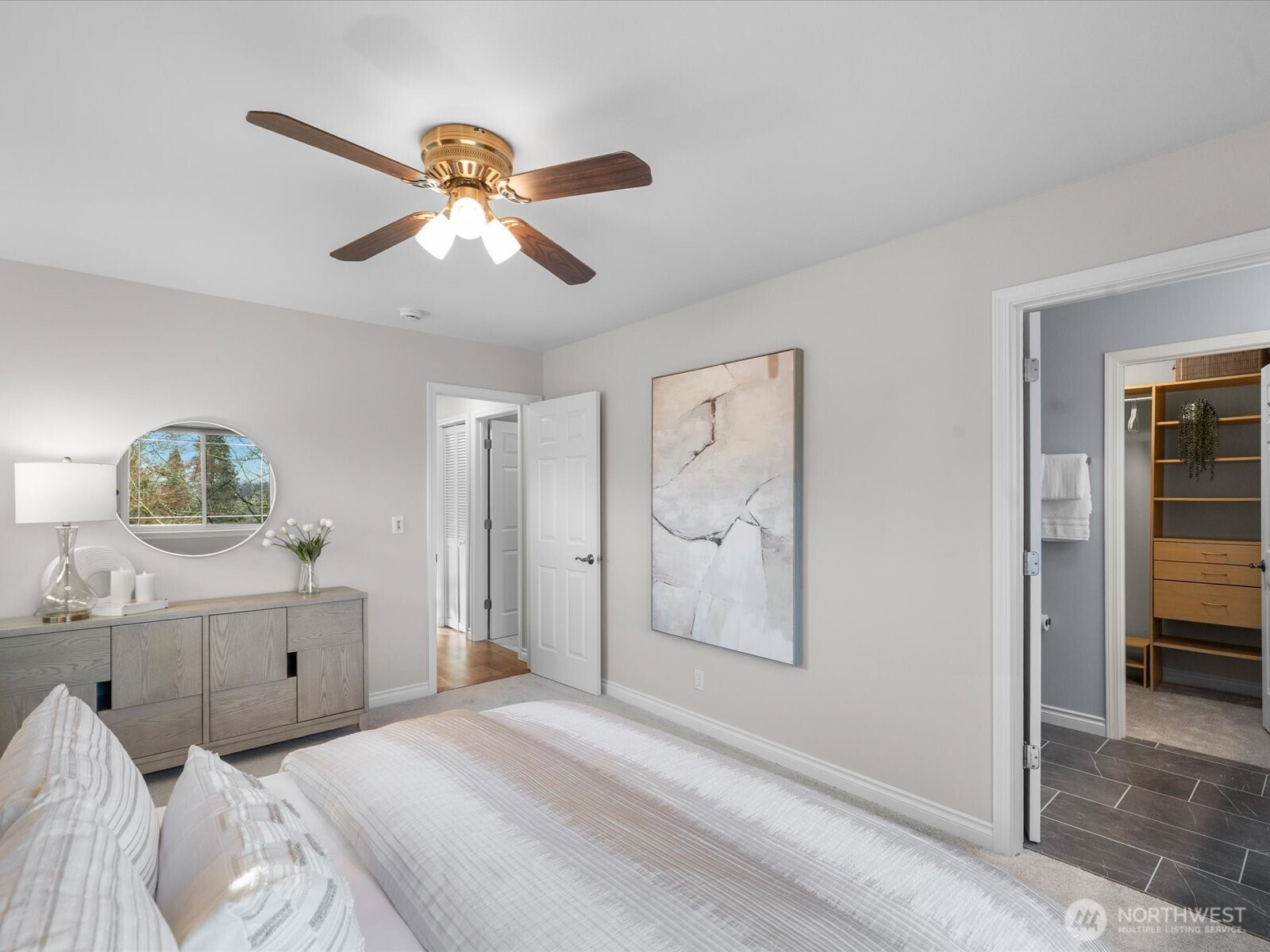 12103 Northeast 168th Place Bothell, WA 98011 - Photo 18 of 36 a bedroom with a bed and a chandelier