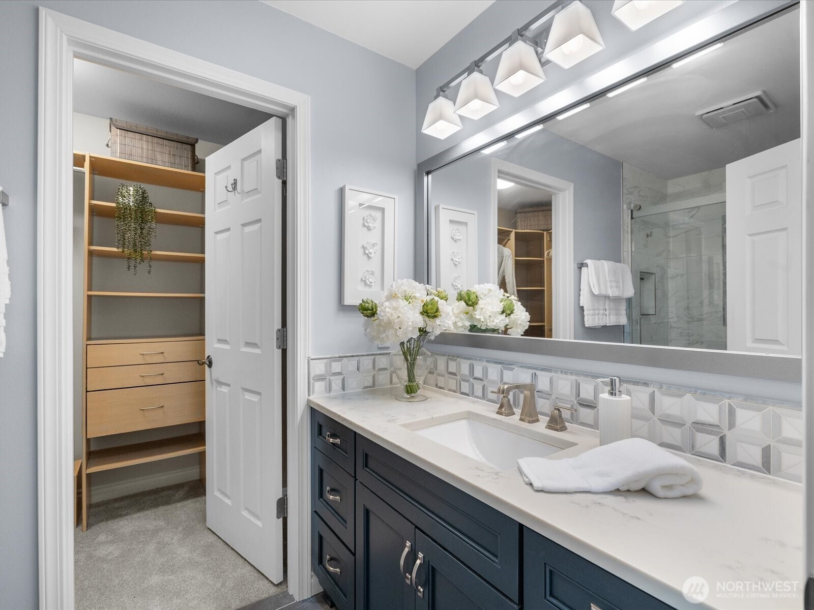 12103 Northeast 168th Place Bothell, WA 98011 - Photo 19 of 36 a spacious bathroom with a granite countertop sink and a mirror