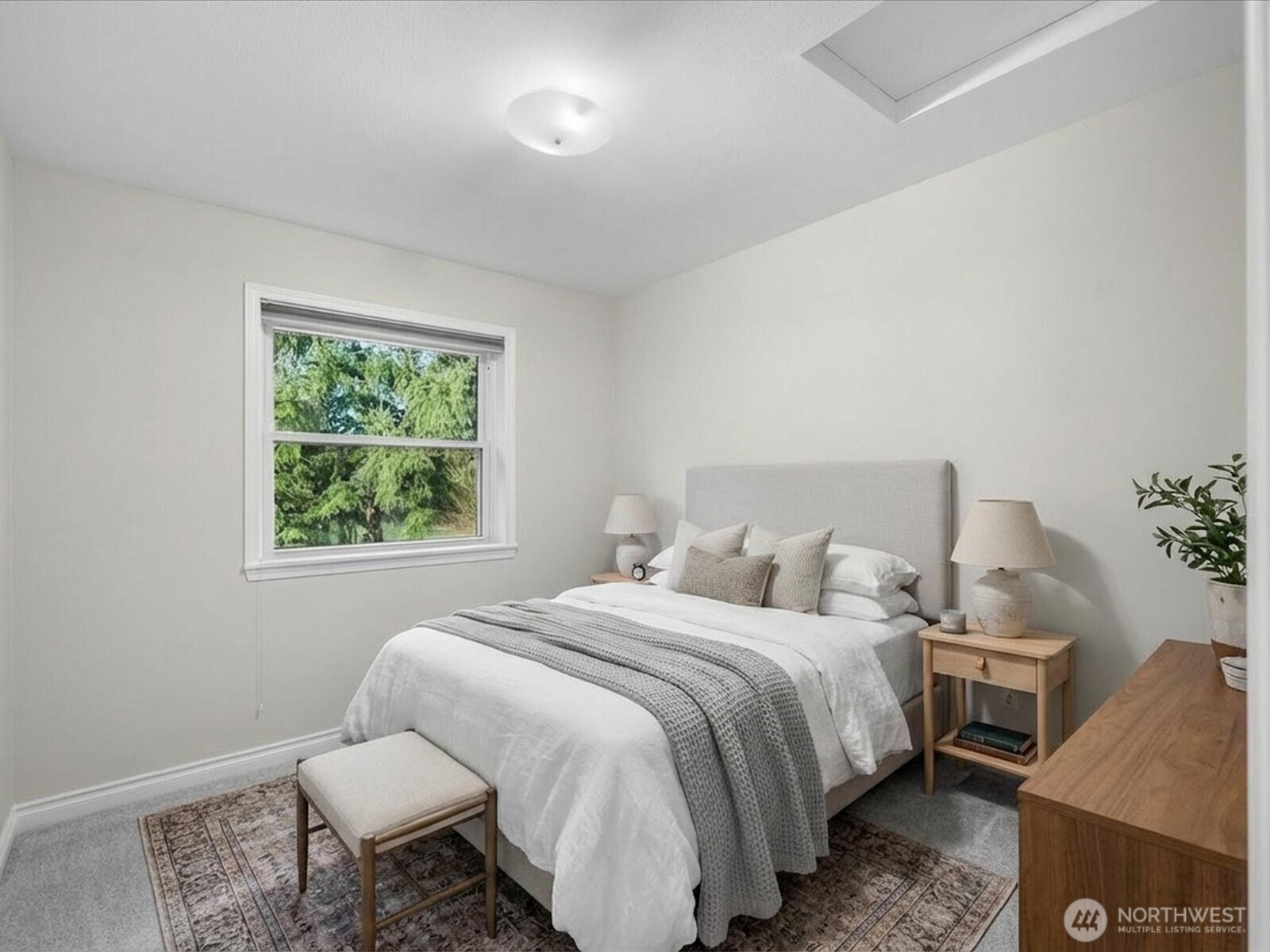 12103 Northeast 168th Place Bothell, WA 98011 - Photo 23 of 36 a bedroom with a bed and a window