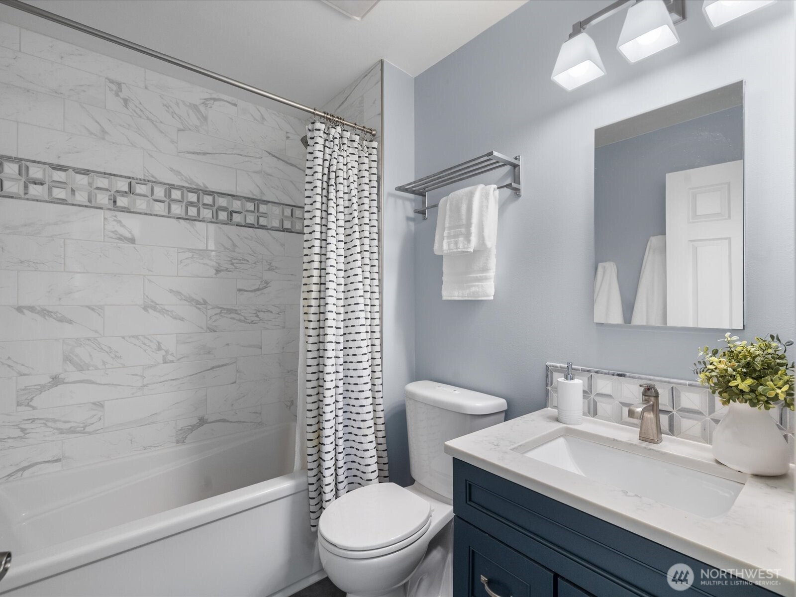 12103 Northeast 168th Place Bothell, WA 98011 - Photo 25 of 36 a bathroom with a sink toilet and shower