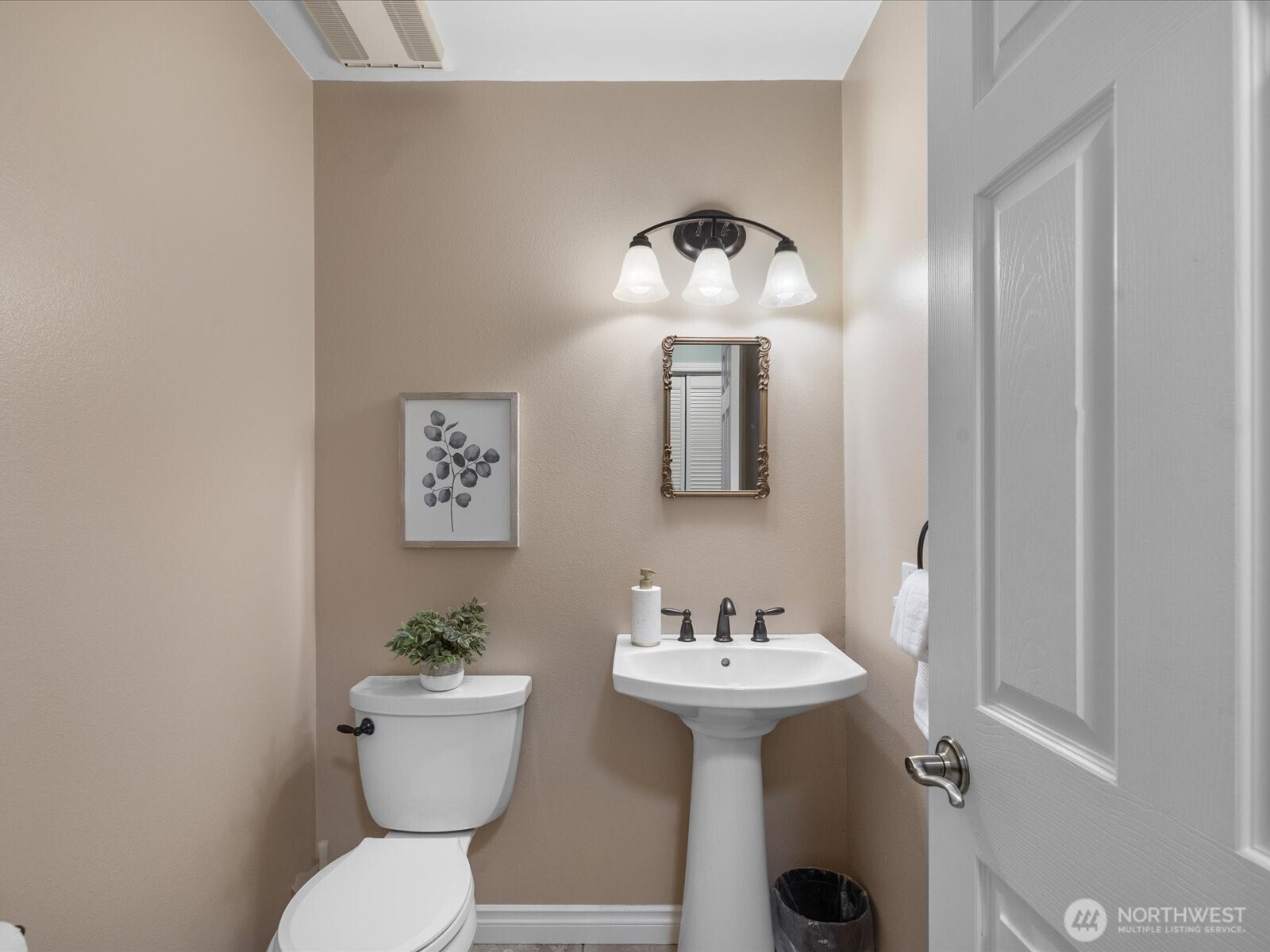 12103 Northeast 168th Place Bothell, WA 98011 - Photo 26 of 36 a bathroom with a toilet sink and mirror