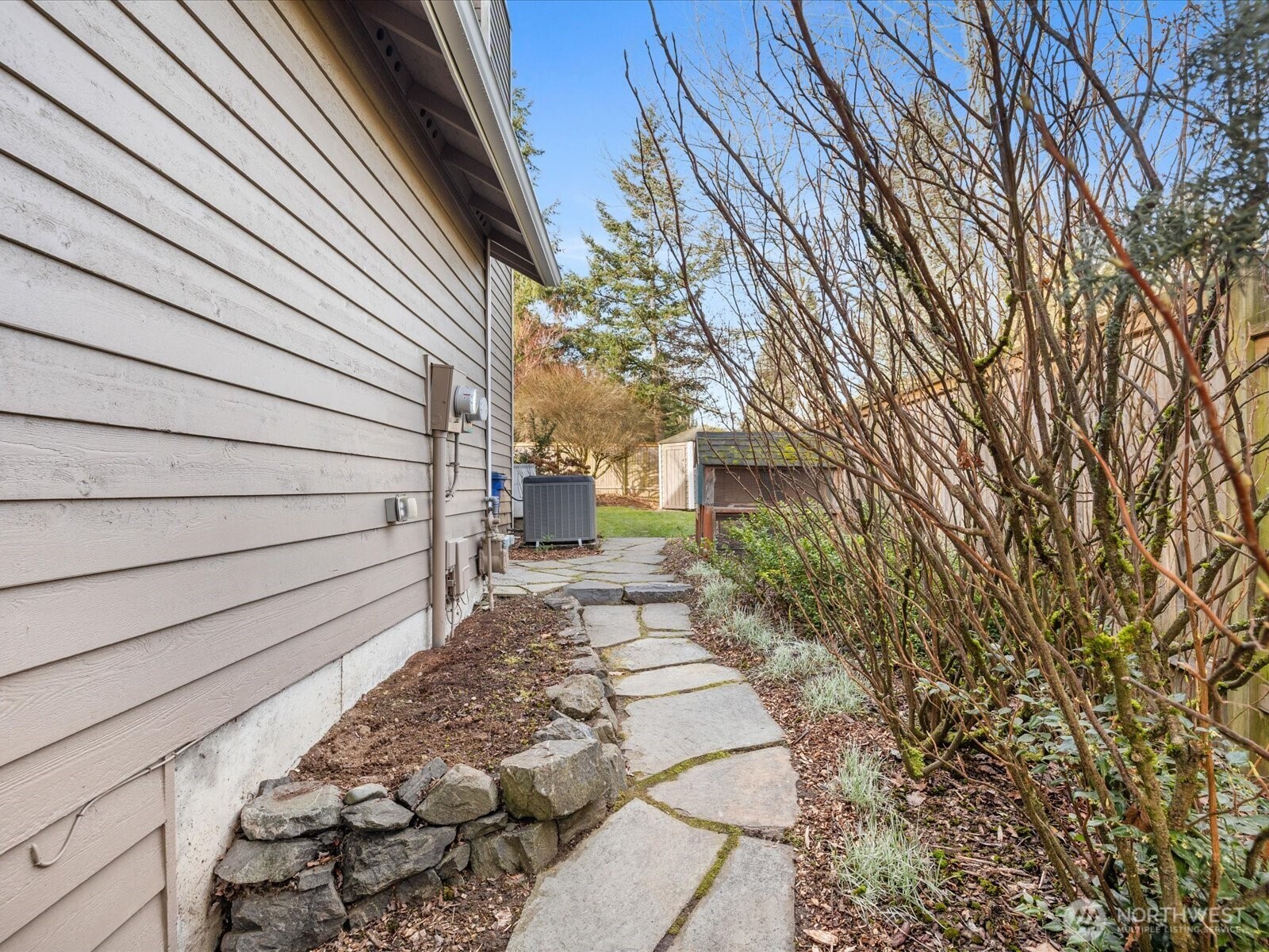 12103 Northeast 168th Place Bothell, WA 98011 - Photo 31 of 36 a view of a house with a backyard