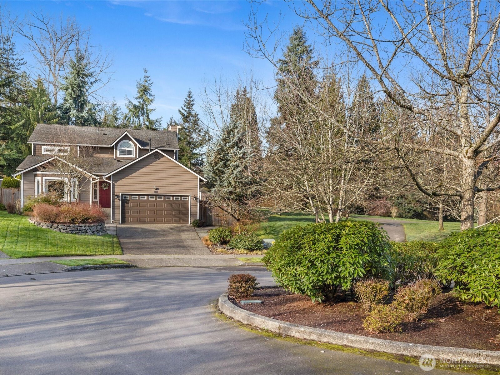 12103 Northeast 168th Place Bothell, WA 98011 - Photo 34 of 36 a front view of a house with a yard
