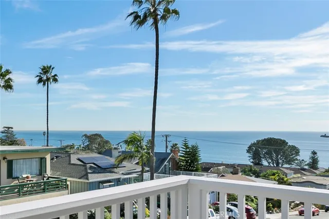 a view of a balcony with chairs