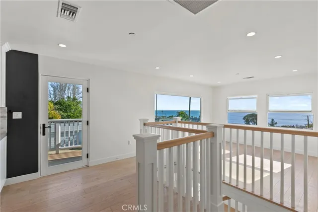 a view of a kitchen with furniture and floor to ceiling window