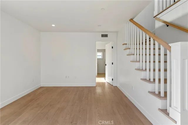 a view of an entryway with wooden floor