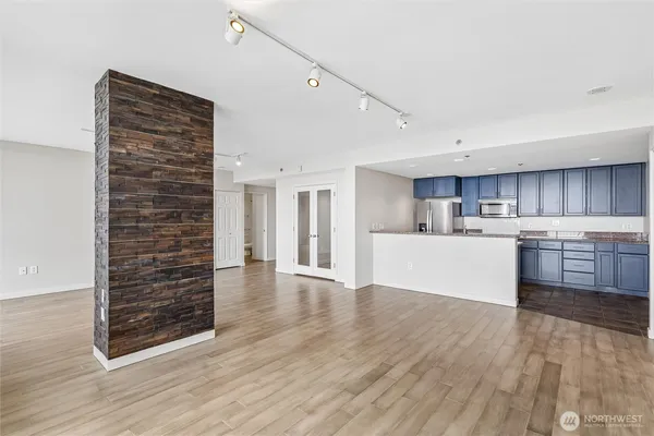 a view of a kitchen with wooden floor