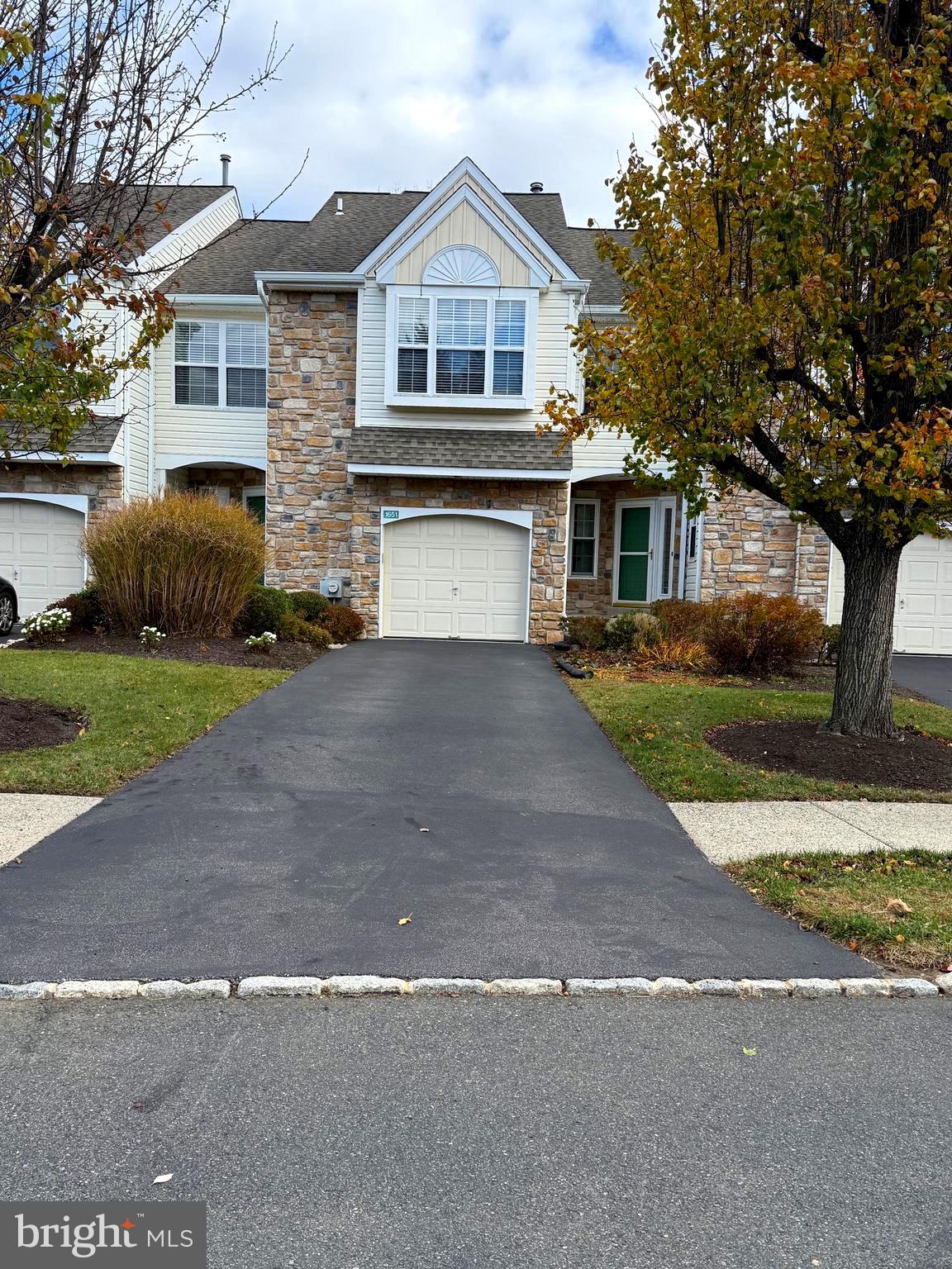 1651 Covington Road Yardley, PA 19067 - Photo 1 of 59 a front view of a house with a yard and garage