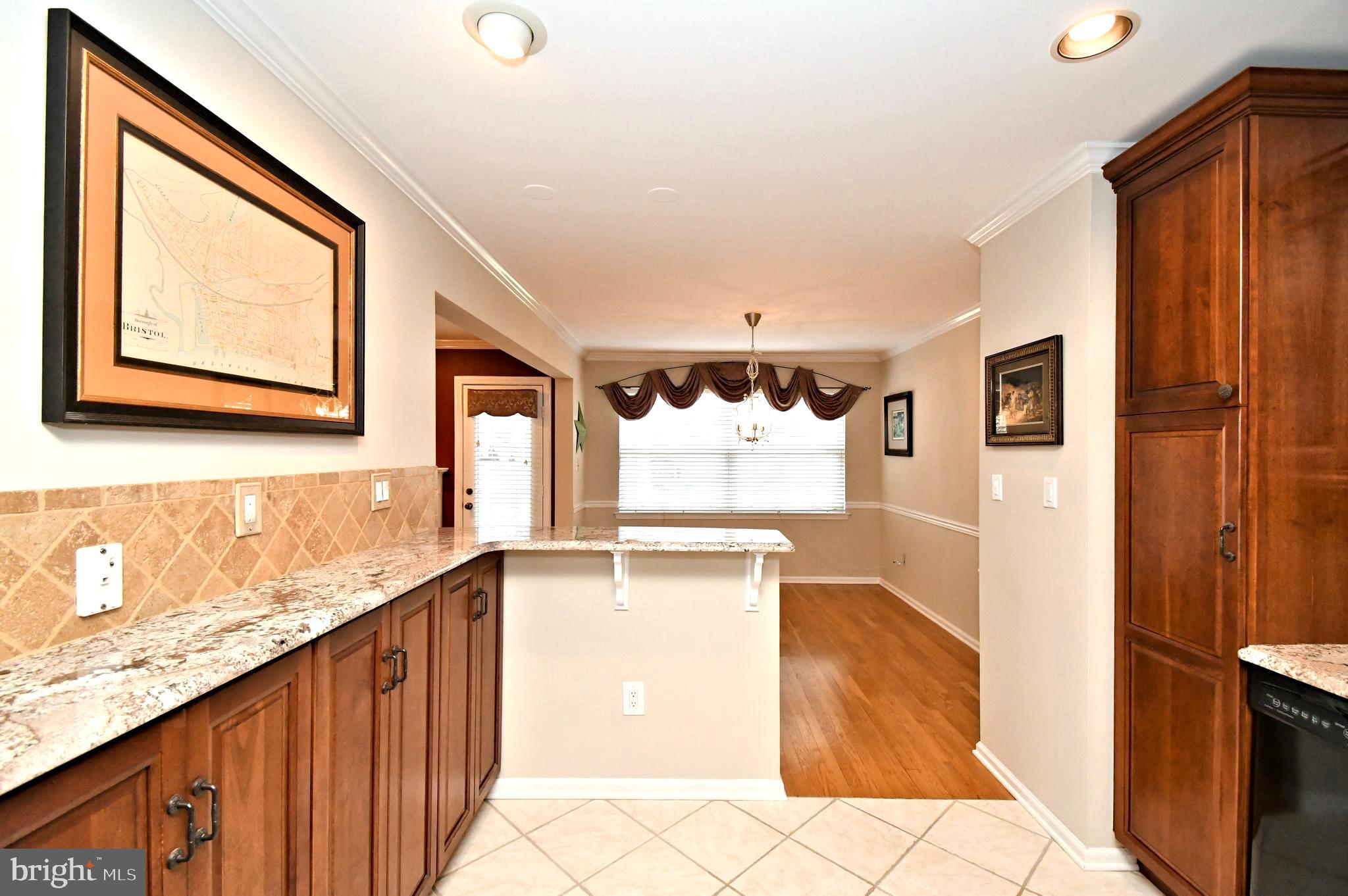 1651 Covington Road Yardley, PA 19067 - Photo 15 of 59 a view of a kitchen with an entryway and wooden floor