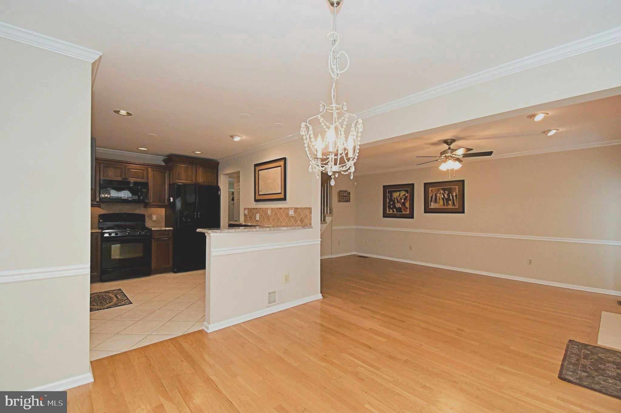 1651 Covington Road Yardley, PA 19067 - Photo 17 of 59 a view of a kitchen with a sink and dishwasher a refrigerator with wooden floor
