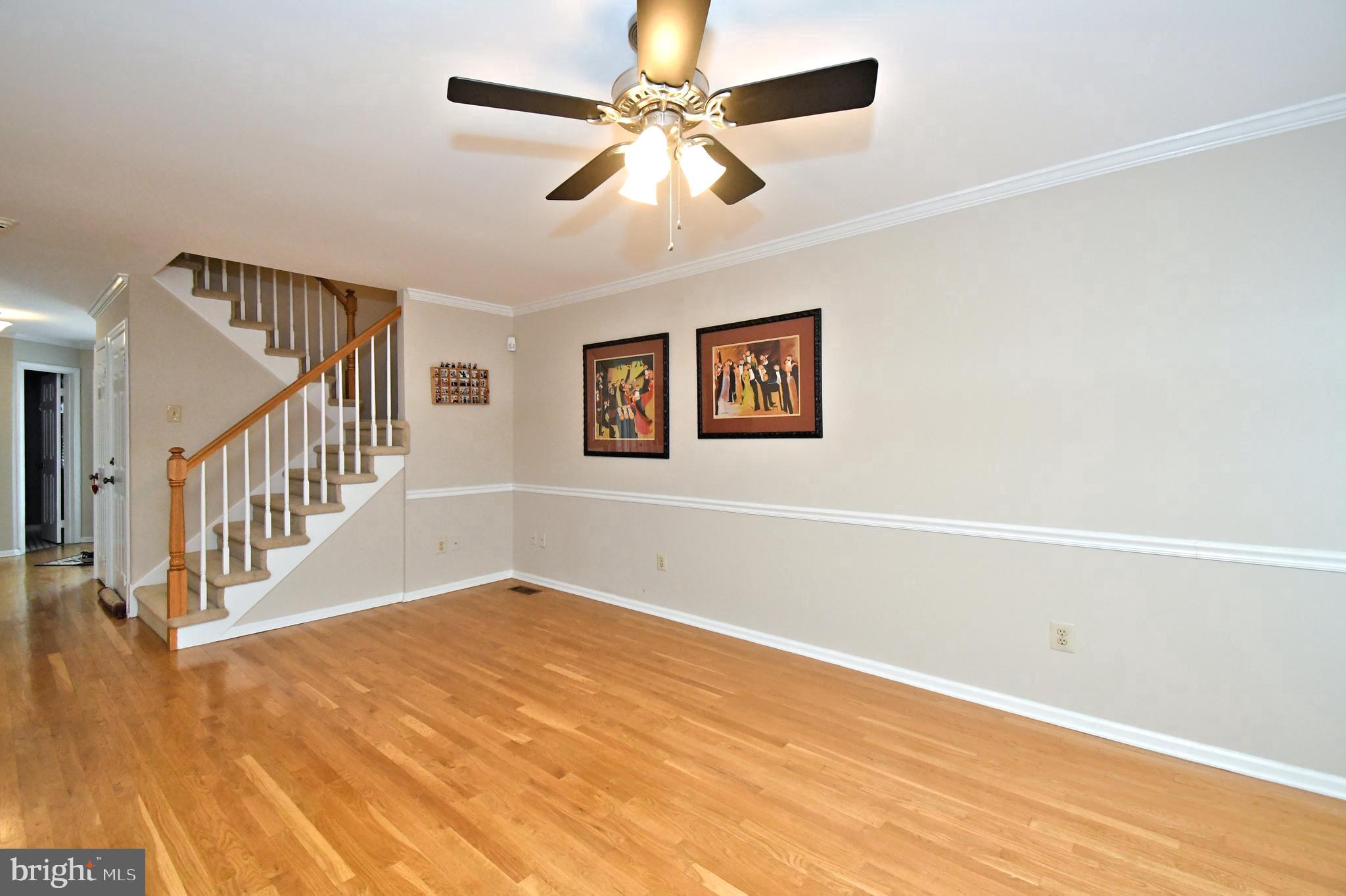 1651 Covington Road Yardley, PA 19067 - Photo 23 of 59 a view of a room with wooden floor and a chandelier fan