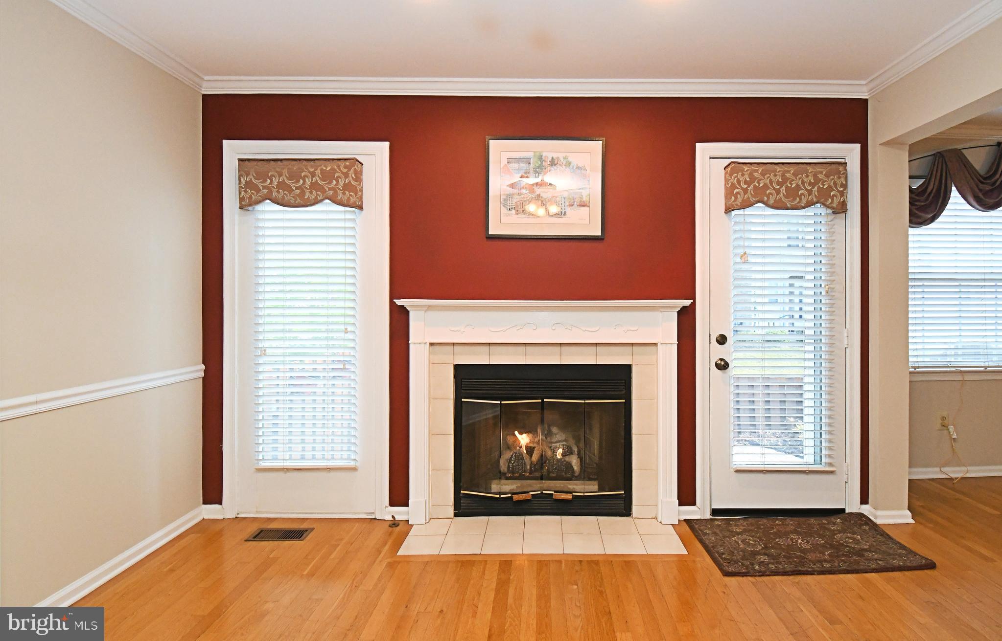 1651 Covington Road Yardley, PA 19067 - Photo 25 of 59 a living room with a fireplace and next to a window