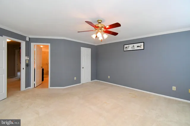 an empty room with a empty space and windows