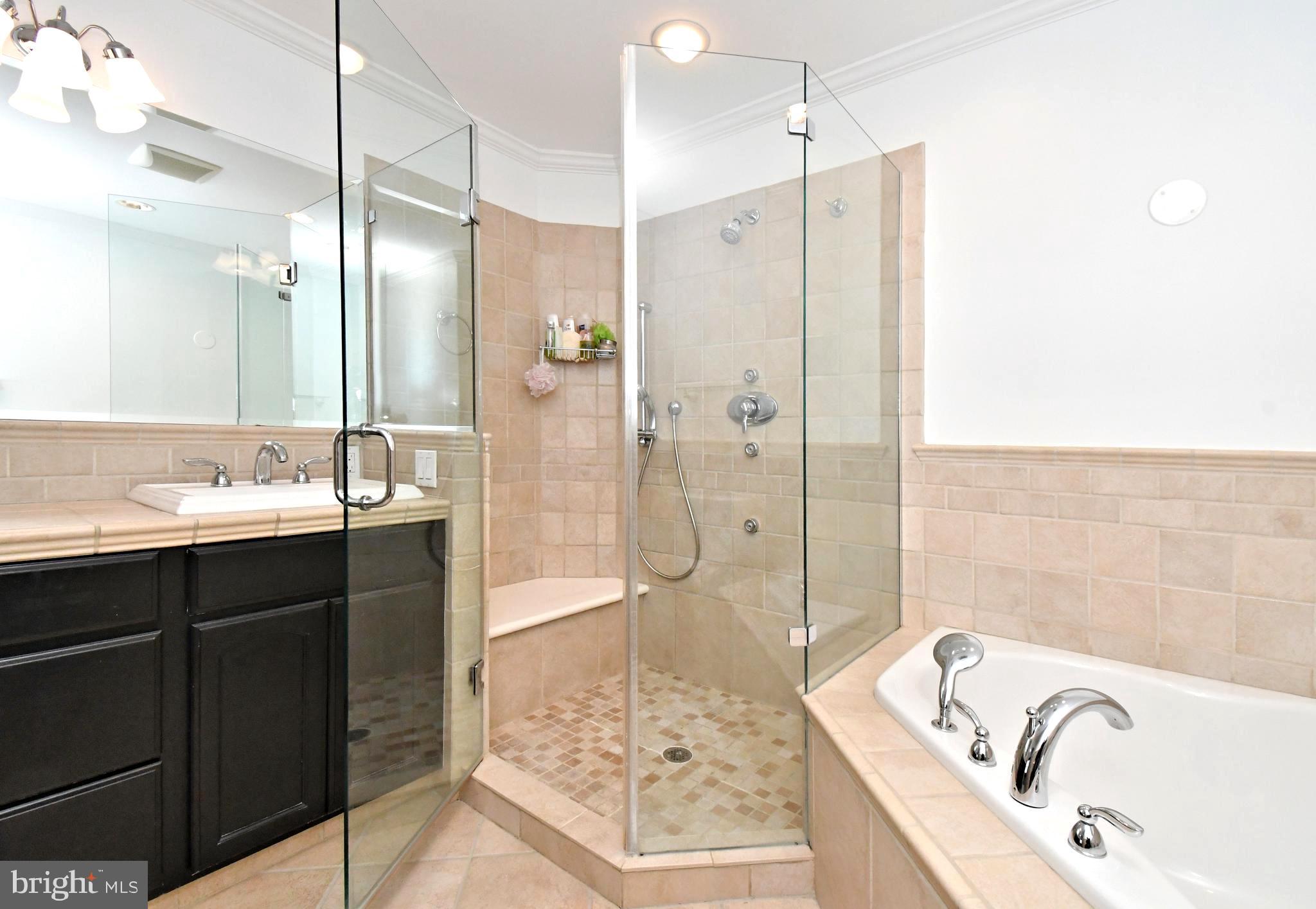 1651 Covington Road Yardley, PA 19067 - Photo 36 of 59 a bathroom with a bathtub sink shower and mirror