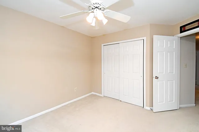a view of a livingroom with a ceiling fan