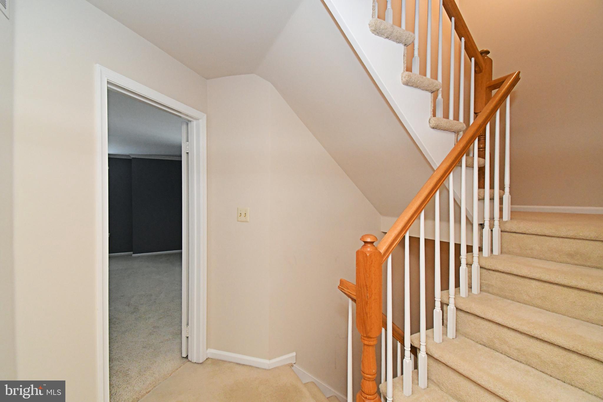 1651 Covington Road Yardley, PA 19067 - Photo 44 of 59 a view of staircase with wooden floor and white walls