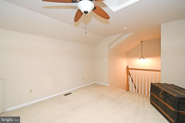 a room with lots of storage and a white refrigerator