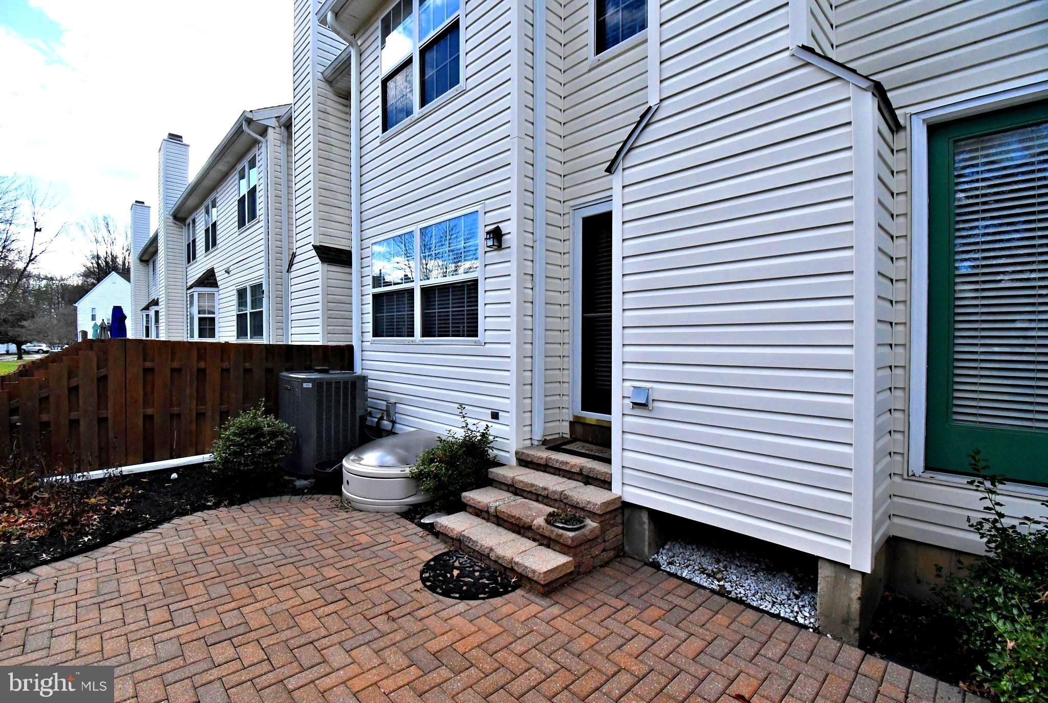 1651 Covington Road Yardley, PA 19067 - Photo 50 of 59 a view of a white house with many windows next to a yard