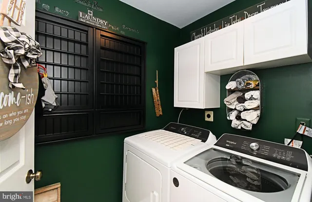 a utility room with washer and dryer