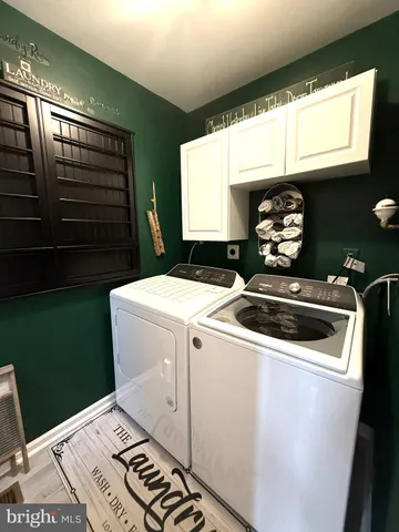 a kitchen with stainless steel appliances granite countertop a refrigerator stove and sink
