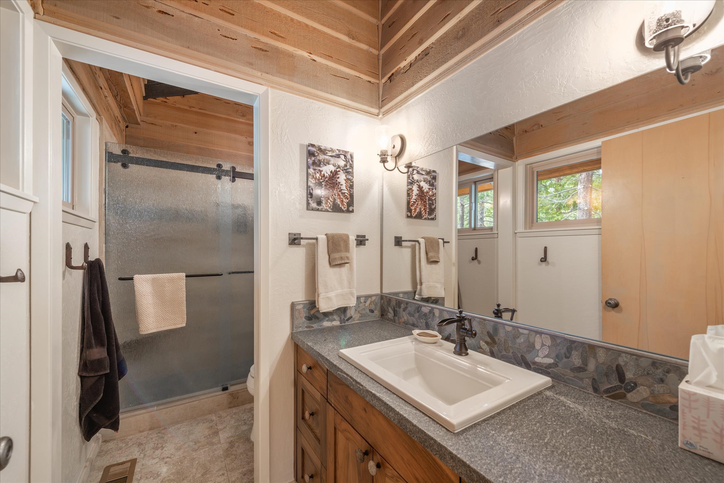 6860 River Road Truckee, CA 96161 - Photo 13 of 21 a bathroom with a sink and a mirror