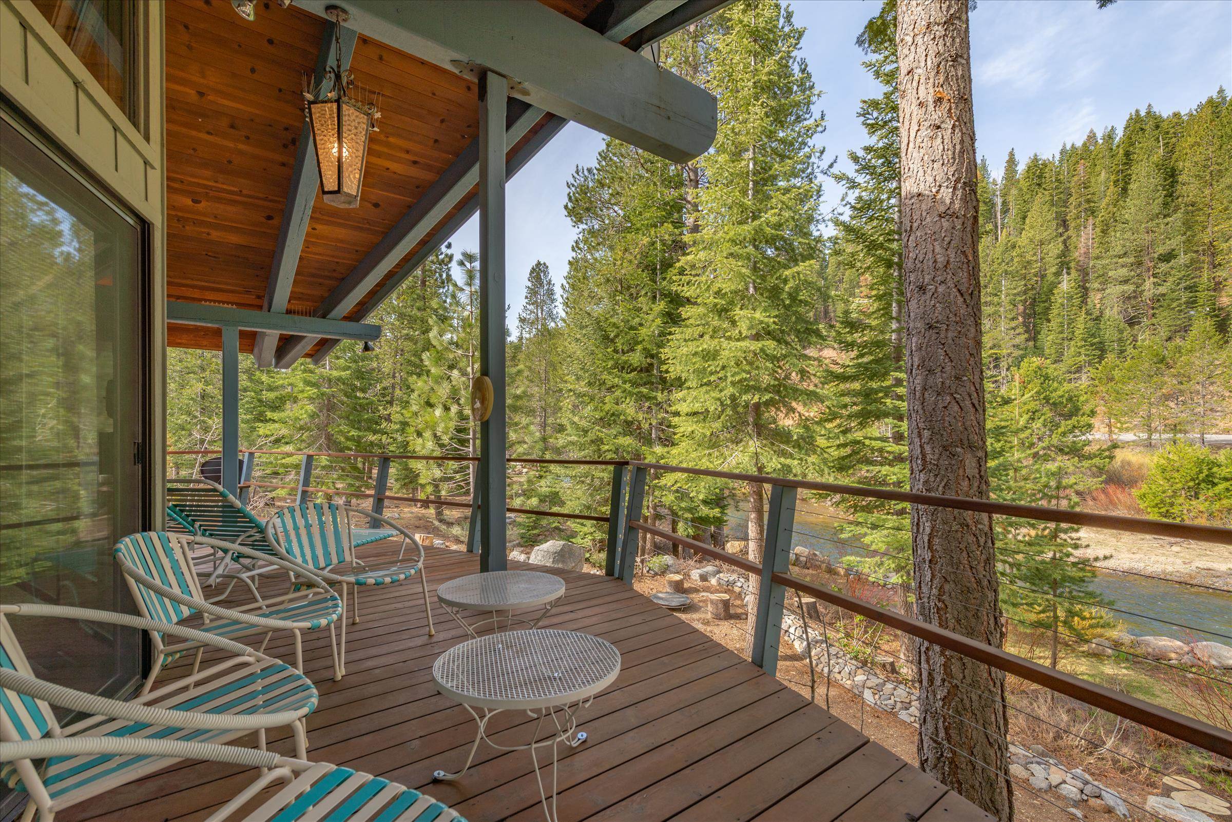 6860 River Road Truckee, CA 96161 - Photo 2 of 21 a view of balcony with chairs and wooden floor