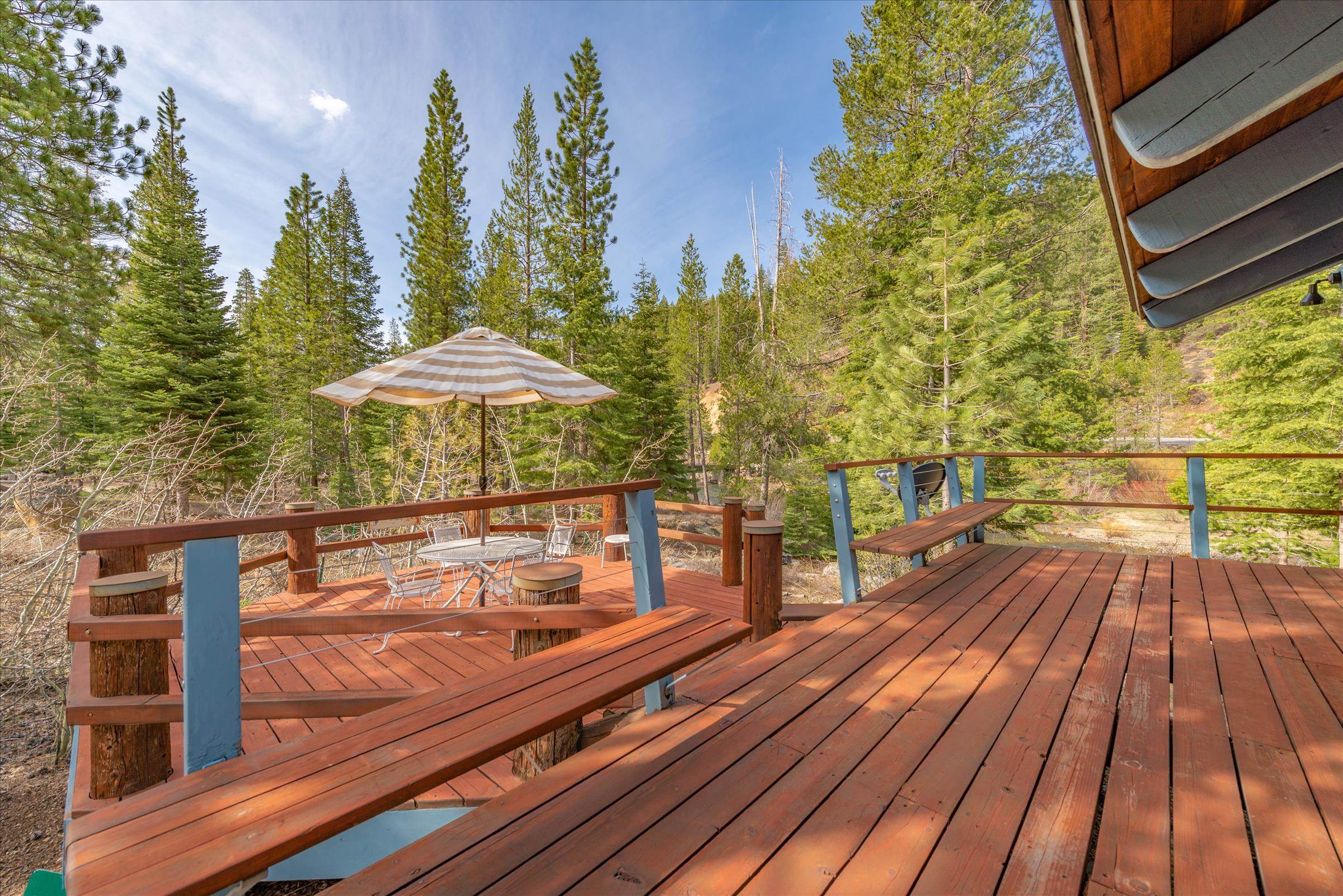 6860 River Road Truckee, CA 96161 - Photo 3 of 21 a balcony with wooden floor and outdoor seating