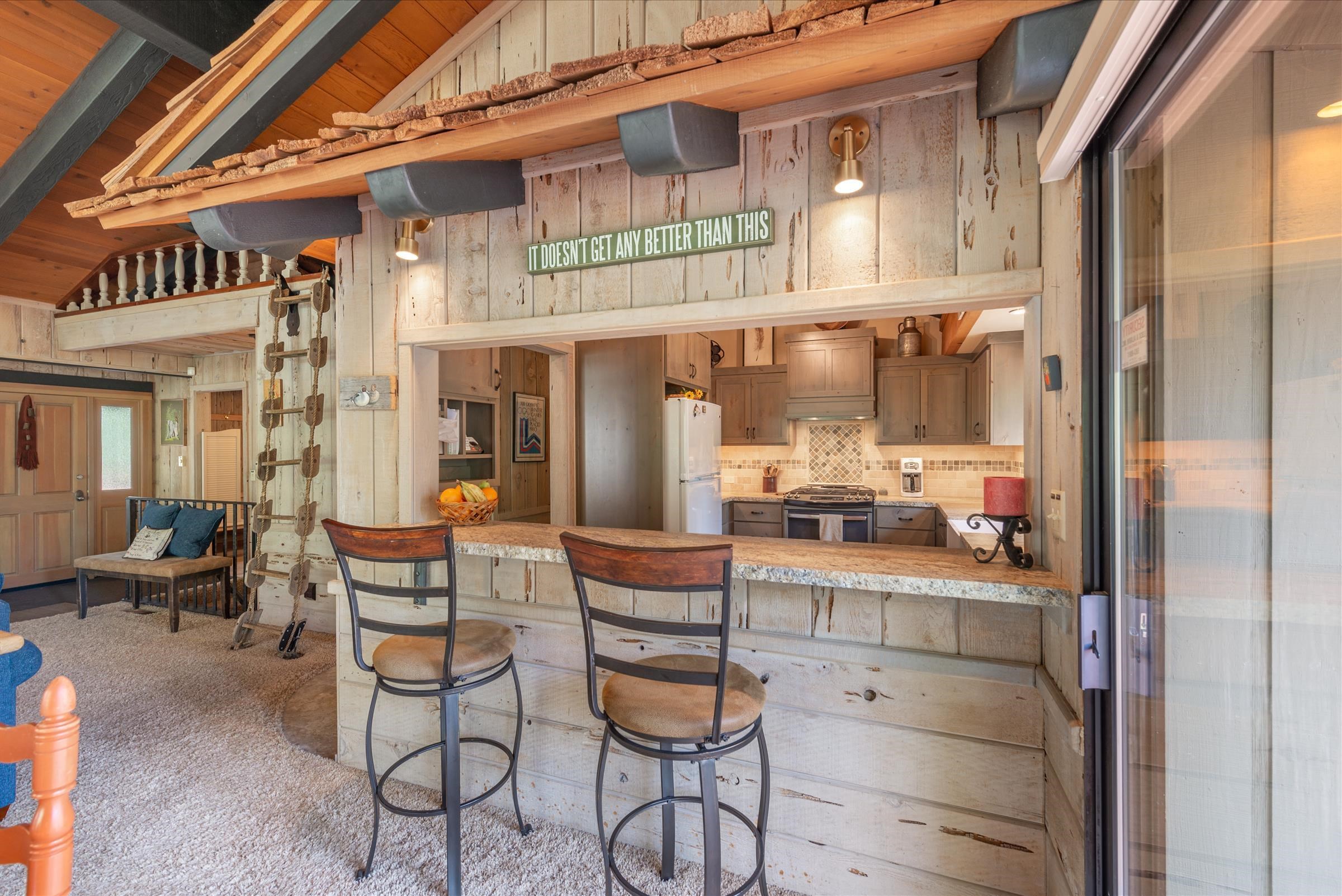 6860 River Road Truckee, CA 96161 - Photo 9 of 21 a view of a chairs with a table and chairs in balcony
