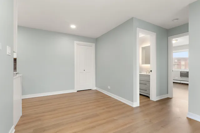 wooden floor in an empty room and a window