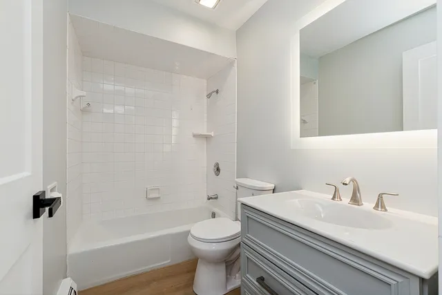 a bathroom with a sink a toilet and a bathtub