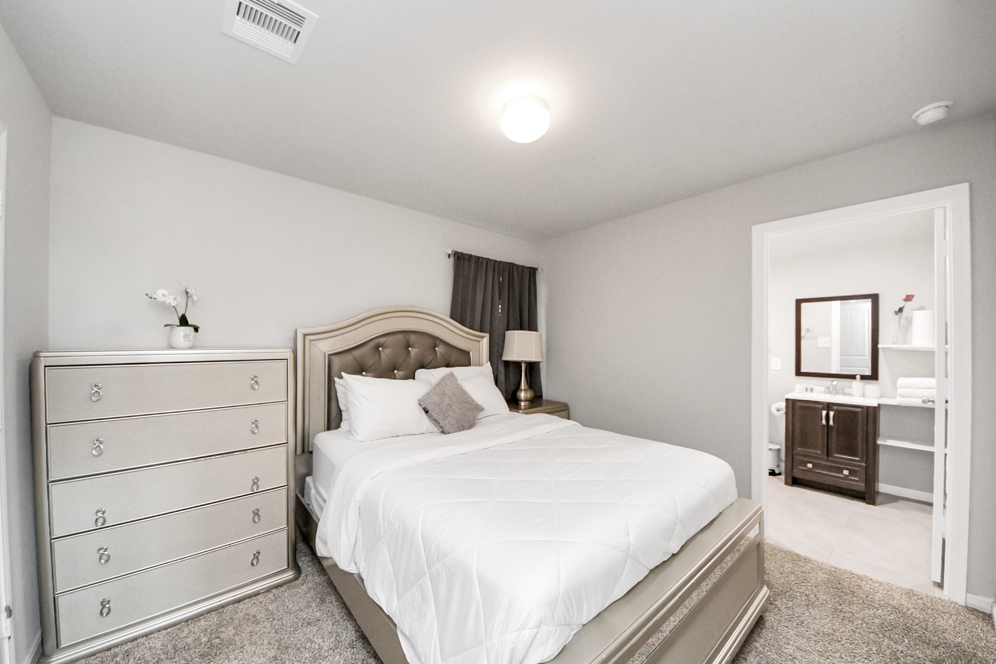 3514 Windham Way Katy, TX 77494 - Photo 15 of 42 a bedroom with a bed and a dresser