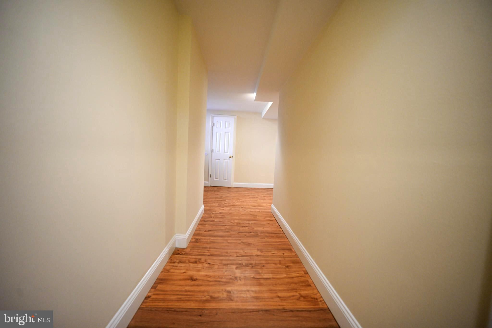 2001 Denison Street Baltimore, MD 21216 - Photo 19 of 43 a view of a hallway with wooden floor
