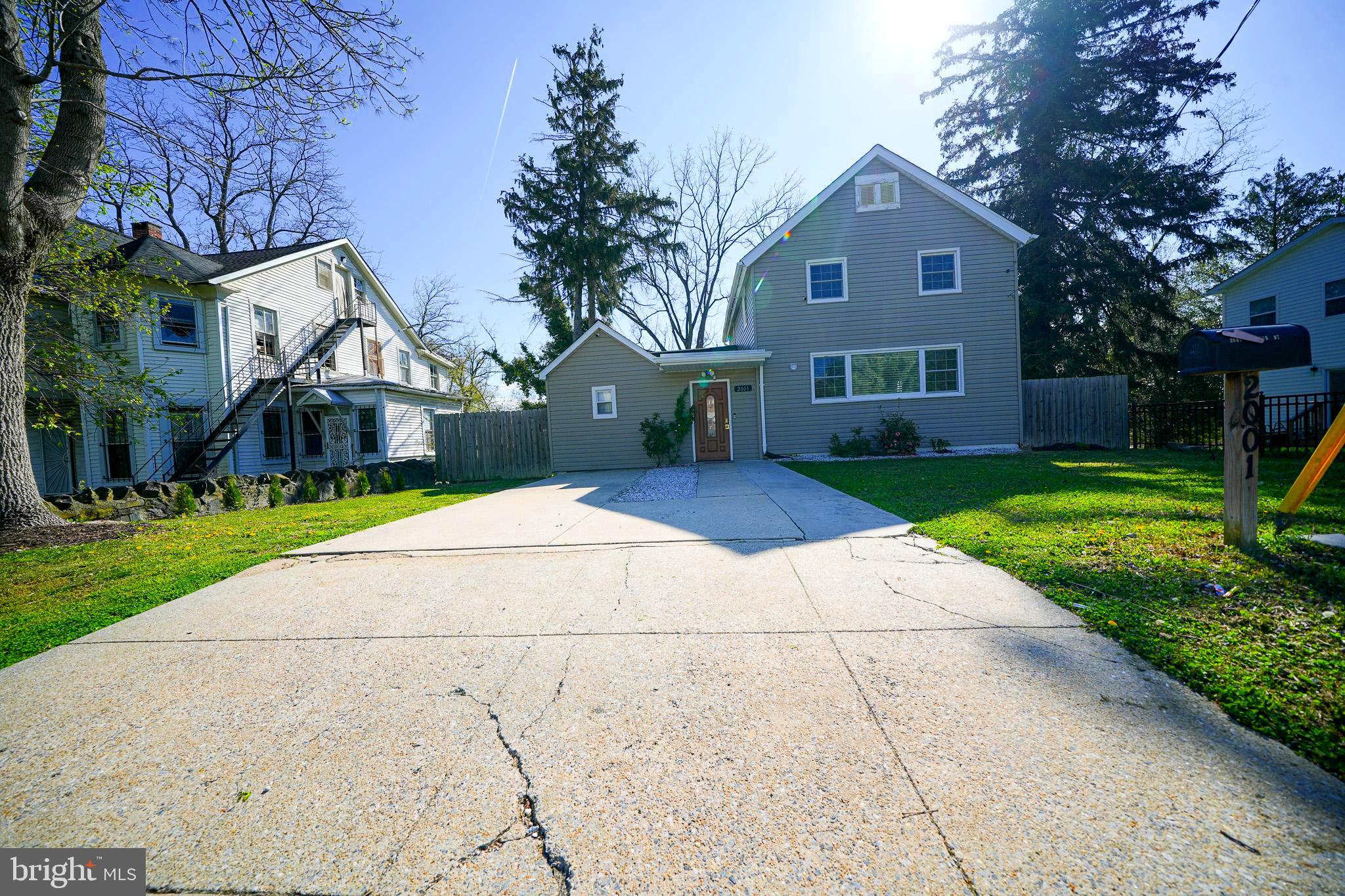 2001 Denison Street Baltimore, MD 21216 - Photo 3 of 43 a front view of house with yard and green space