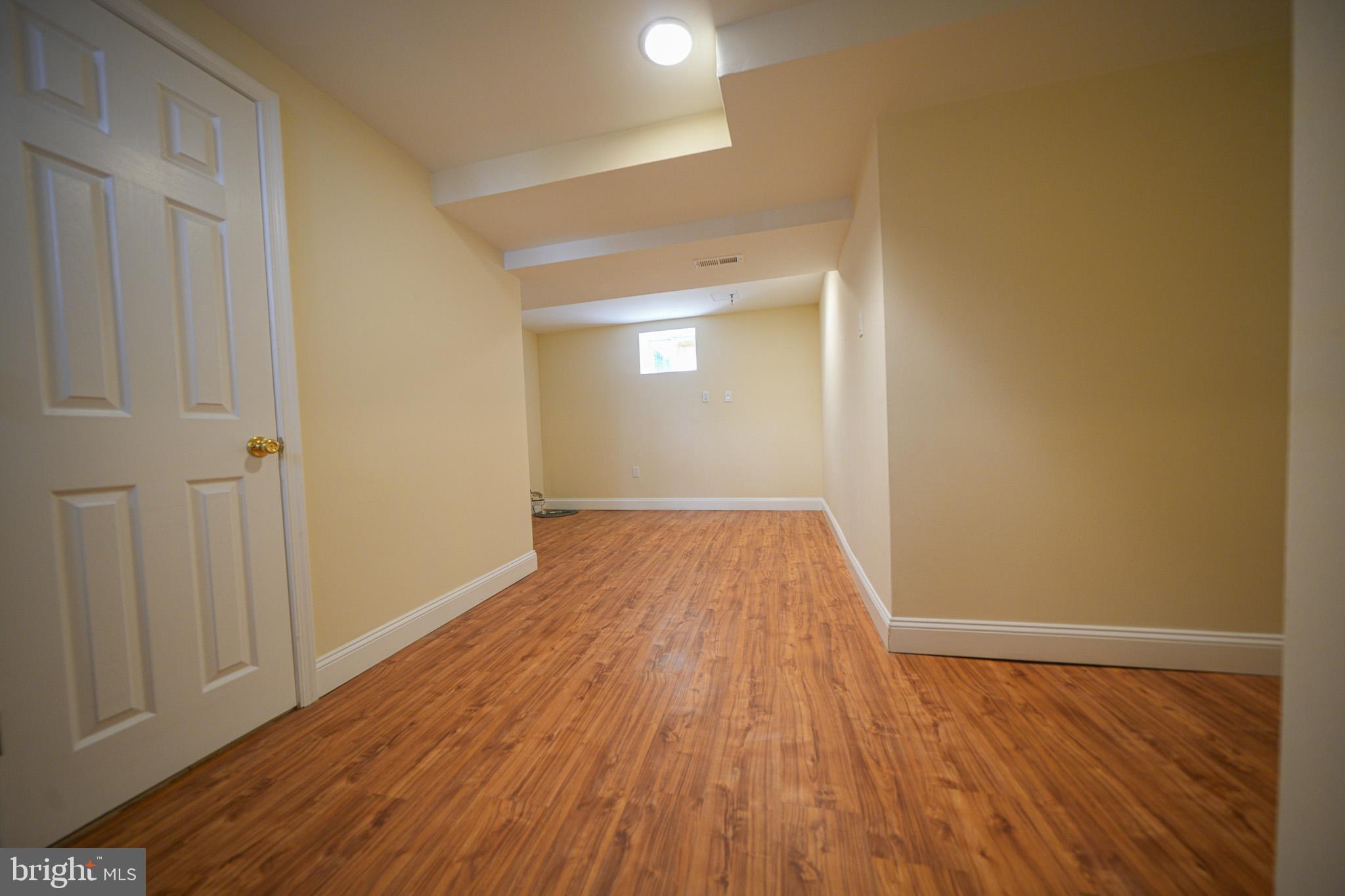 2001 Denison Street Baltimore, MD 21216 - Photo 33 of 43 a view of a room with wooden floor and a sink
