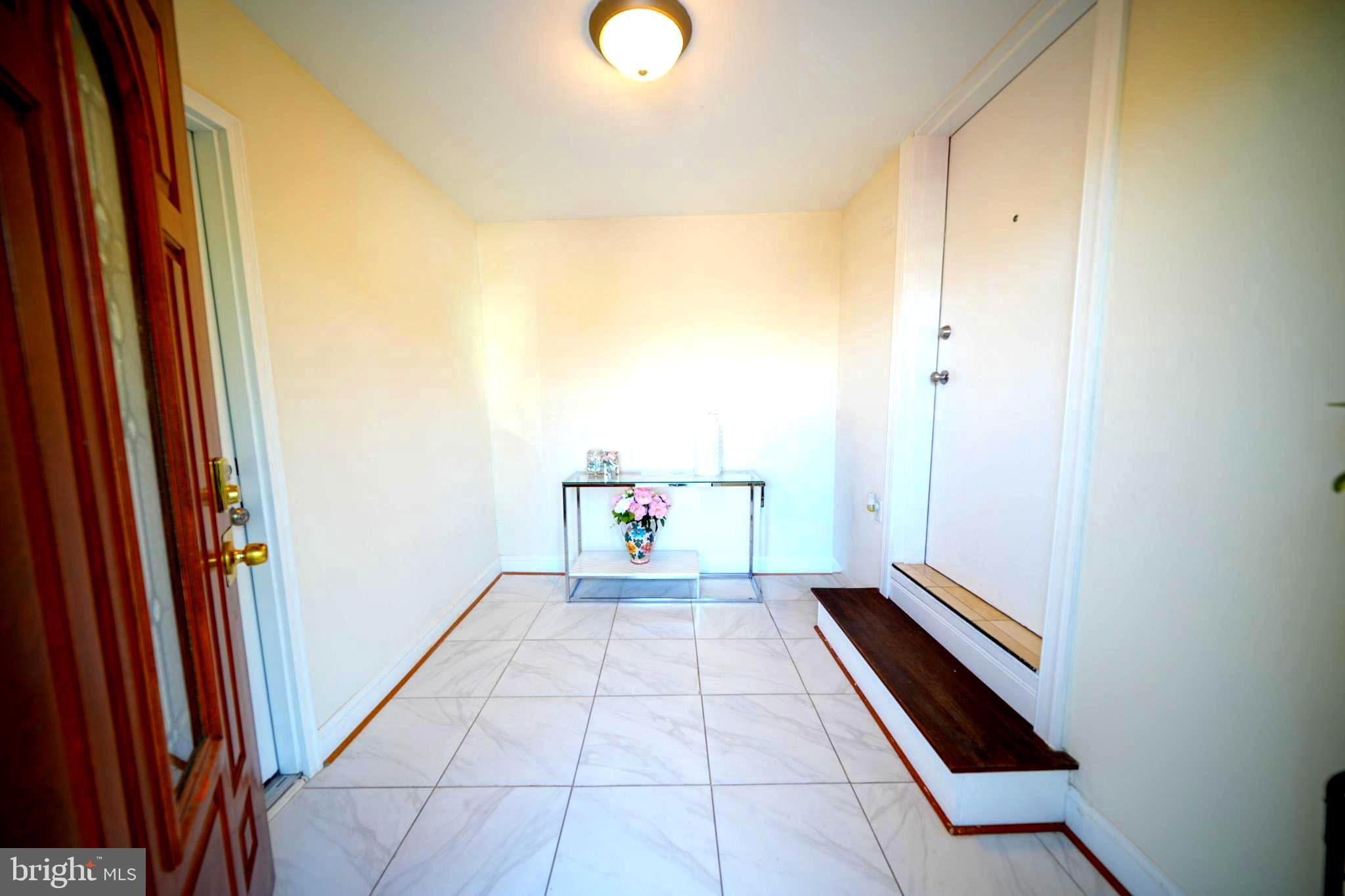 2001 Denison Street Baltimore, MD 21216 - Photo 5 of 43 a hallway with a large window