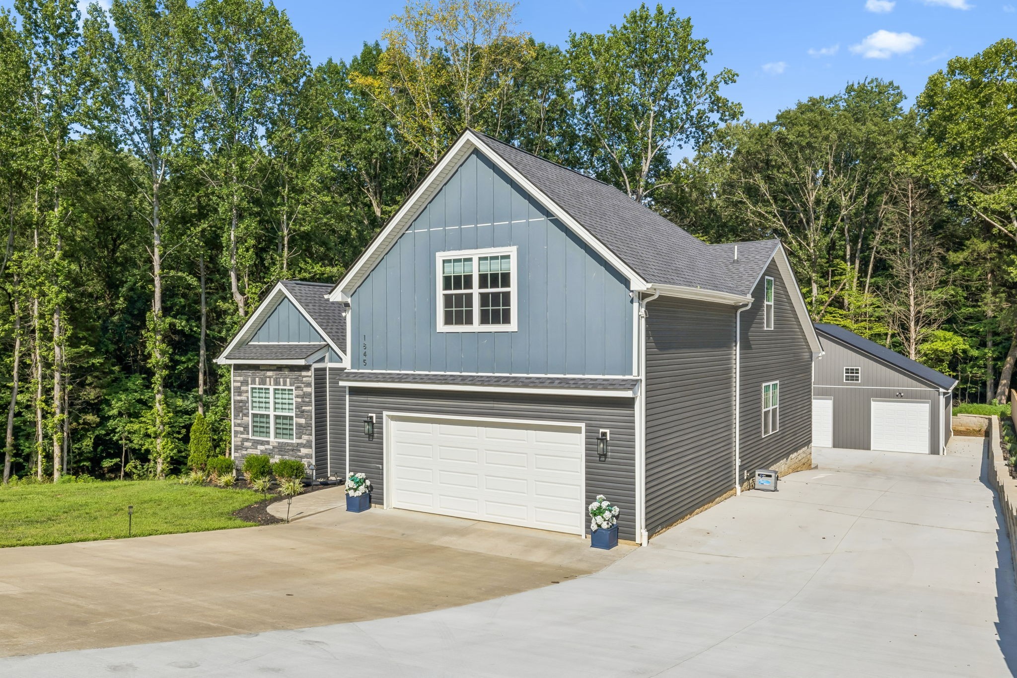 1845 Dinsmore Road Clarksville, TN 37040 - Photo 2 of 36 a front view of a house with a yard and garage
