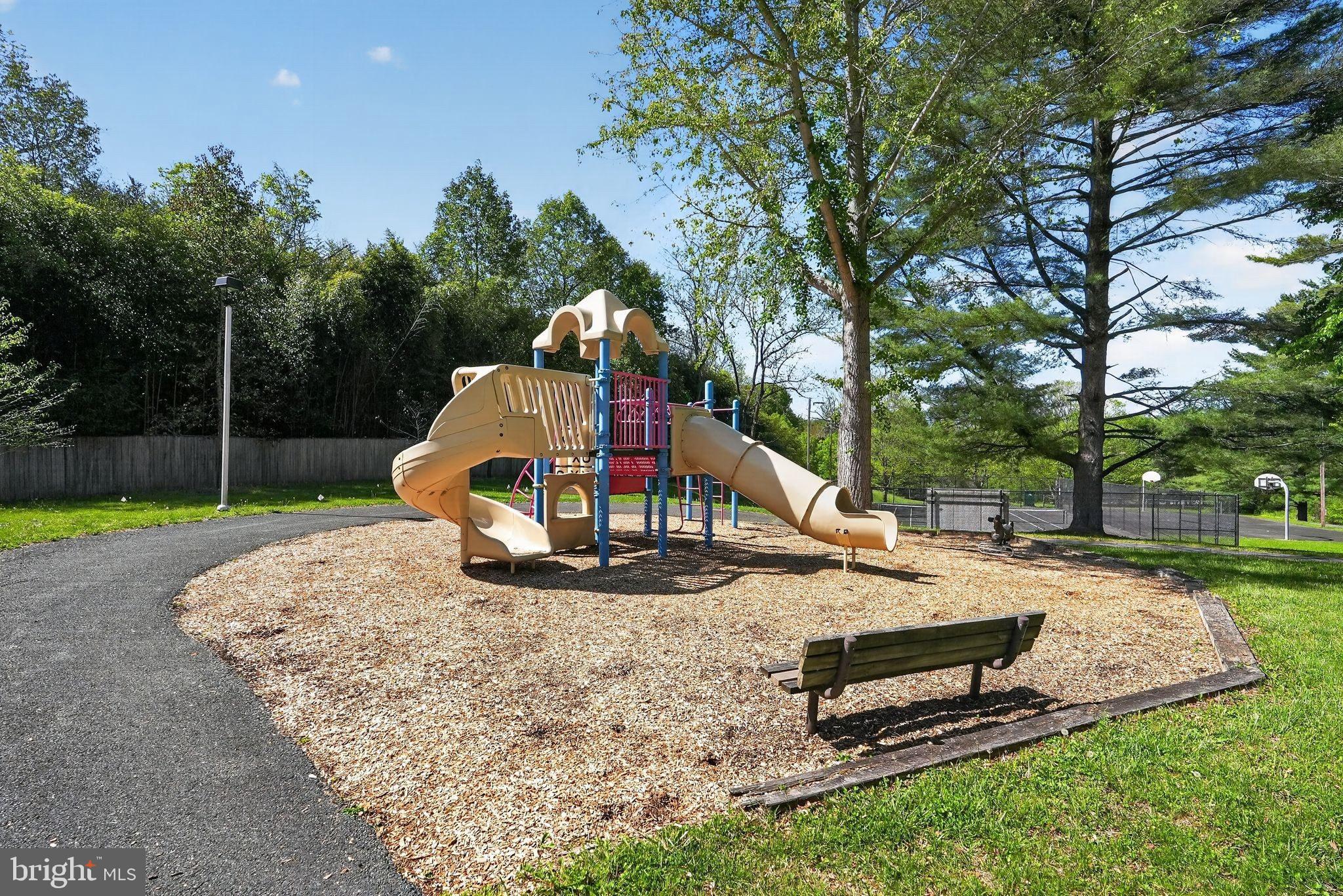 13821 Esworthy Road Darnestown, MD 20874 - Photo 96 of 98 a park view with a bench and trees